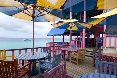 Shaded sun deck with chair and tables